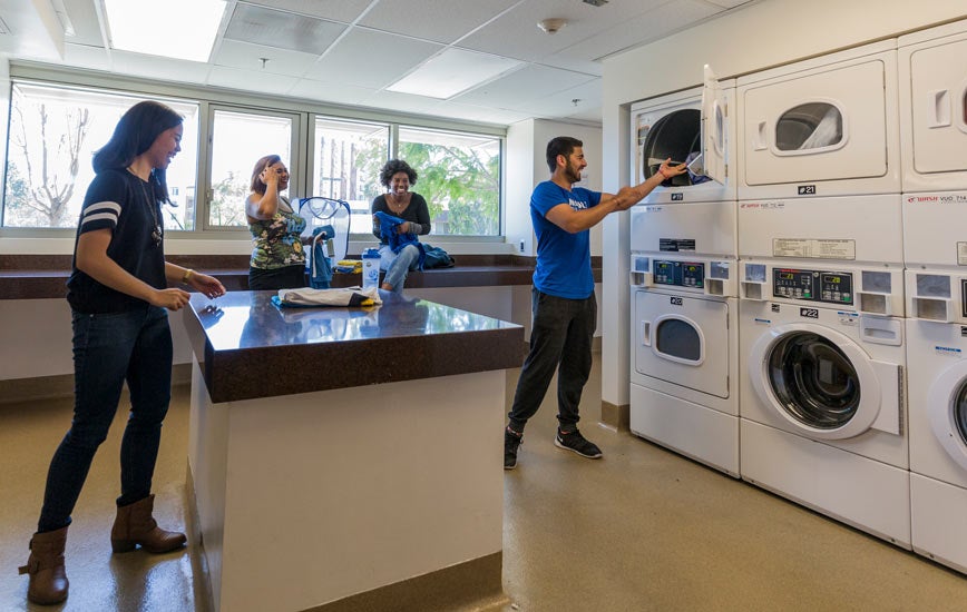Students using on-site laundry machines